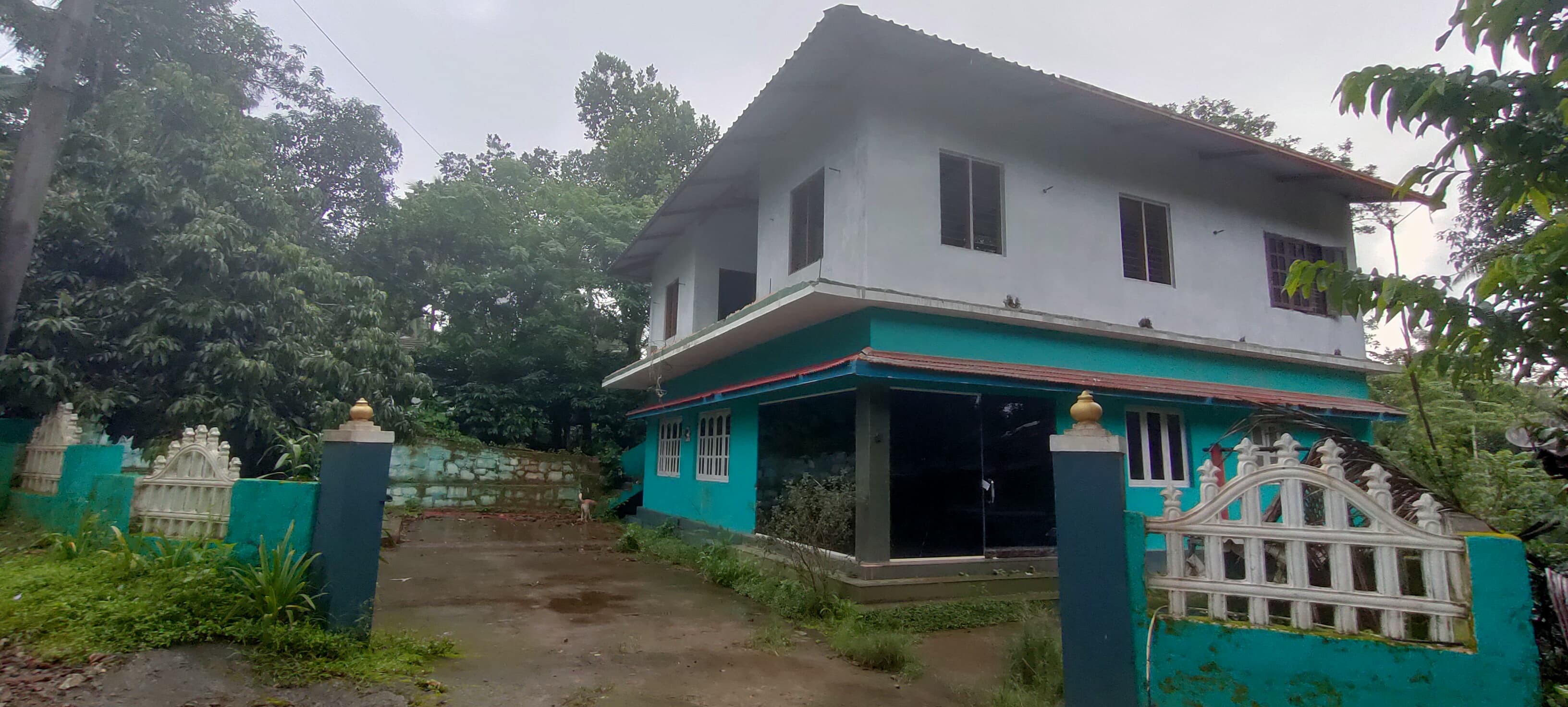 RESIDENTIAL HOUSE WITH A COMMERCIAL EXTENSION for sale in Virajpete